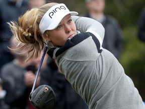 LPGA Tour star Brooke Henderson hits some balls during a demonstration for kids at the Eagle Creek Golf Club in Dunrobin, Ont., on Tuesday. Henderson was attending the Kevin Haime Kids to the Course Classic.