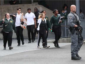 Students are released from a "shelter in place" lockdown at St. Patrick;s High School on May 28.