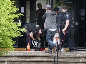 Ottawa police search a students bag before he entered St. Pat's High School in Ottawa Tuesday May 28, 2019. St. Patrick's High School remains in shelter in place mode following an email threat.