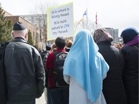 People demonstrate against the Quebec government's newly tabled Bill 21 in Montreal, Sunday, April 14, 2019.