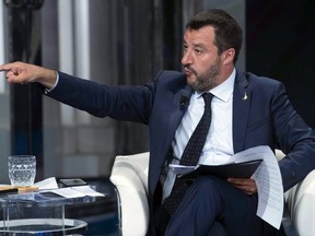 In this photo taken on Wednesday, May 22, 2019, Italian Deputy Premier and Interior Minister, Matteo Salvini, gestures as he takes part in a RAI State TV show in Rome. Dutch and British voters were the first to have their say Thursday in elections for the European Parliament, starting four days of voting across the 28-nation bloc that pits supporters of deeper integration against populist euroskeptics who want more power for their national governments.
