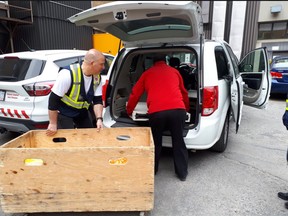 Volunteers for the Ottawa Salvation Army load food and deploy to various locations throughout the city.