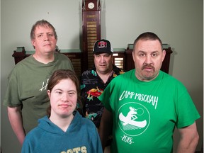 (Clockwise from lower left) Suzanne Winter-Heartson, 32, Brian Jones, 48, Scott Helman, 50, and Paul Pringle, 45,. They are four of 33 workers with developmental disabilities who have been told their contract shredding paper for the federal government will end next year.