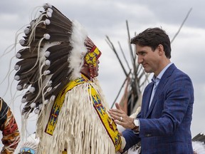 Prime Minister Justin Trudeau shakes hands with Assembly of First Nations Chief Perry Bellegarde during the exoneration for Chief Poundmaker event at a community ceremony at the Chief Poundmaker Historical Centre on the Poundmaker First Nation, Thursday, May 23, 2019.