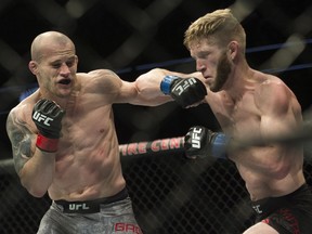 Mitch Gagnon (left) fights Cole Smith (right) during UFC Fight Night Bantamweight bout held at Canadian Tire Centre on Saturday.