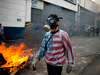 Anti-government protesters clash with security forces in Caracas on May 1, 2019.