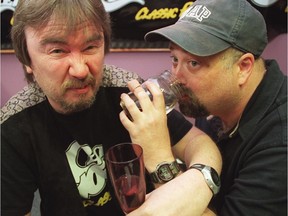 A classic photo of Woody and Doc from Chez 106.1FM drinking water from Lake Ontario in 2000, after losing a Sens-Leafs series bet with Toronto radio station DJ Stu Jeffries.