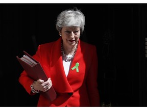 Britain's Prime Minister Theresa May leaves 10 Downing Street for her weekly Prime Minister's Questions in the House of Commons in London, Wednesday, May 15, 2019.