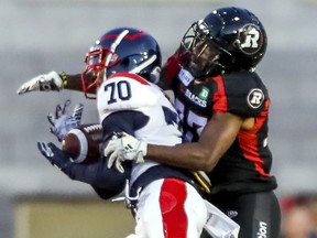 Montreal Alouettes Quan Bray makes a catch in front of Ottawa Redblacks DeAndre Farris during Canadian Football League preseason game in Montreal Thursday June 6, 2019.