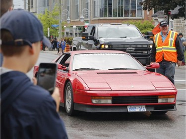 Car owners and spectators take part in the Italian car parade as part of the Italian Festival on Saturday.