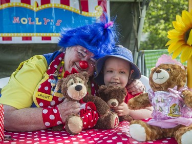 CHEO oncology patient Nathan Quesnel, 4, and his teddy bear, Molly, clown around with Molly, also from CHEO, at the CHEO Teddy Bear picnic at Rideau Hall.