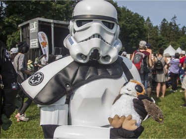 A stormtrooper poses with a porg at the annual CHEO Teddy Bear picnic at Rideau Hall on Saturday.