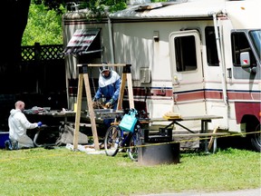 Investigators with the Office of the Fire Marshal, along with Brockville police investigate the discovery of a deceased man and a small fire contained to the camper at St. Lawrence Park.