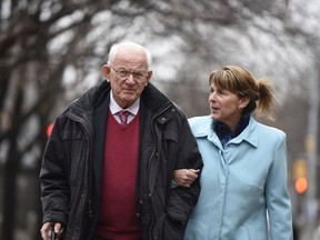 Gus Casey, left, and LeeEllen Carrol, father and wife of Bryan Casey, arrive at the Ottawa Courthouse for the sentencing of Christy Natsis on Thursday, November 12, 2015.