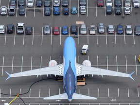 A Boeing 737 MAX airplane is stored on an employee parking lot adjacent to Boeing Field, on June 27, 2019 in Seattle, Washington.