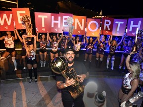 Drake carries the Larry O'Brien NBA championship trophy as he celebrates the Toronto Raptor's title at XS Nightclub at Wynn Las Vegas on Friday.