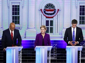 MIAMI, FLORIDA - JUNE 26: (L-R) Sen. Cory Booker (D-NJ) ,Sen. Elizabeth Warren (D-MA)  and former Texas congressman Beto O'Rourke look on during the first night of the Democratic presidential debate on June 26, 2019 in Miami, Florida.  A field of 20 Democratic presidential candidates was split into two groups of 10 for the first debate of the 2020 election, taking place over two nights at Knight Concert Hall of the Adrienne Arsht Center for the Performing Arts of Miami-Dade County, hosted by NBC News, MSNBC, and Telemundo.