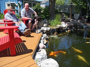 James Stone and his father Robert relax in James's garden in Kanata.