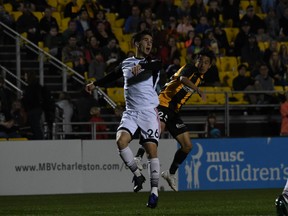 Ottawa Fury FC's Thomas Meilleur-Giguère jostles with Kotaro Higashi of the Charleston Battery when the two teams met earlier this season. (Charleston Battery/USL Championship)