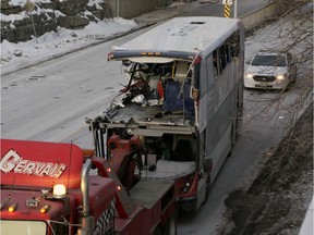 The OC Transpo bus involved in the Jan. 11 crash at Westboro Station is towed from the scene the following day.