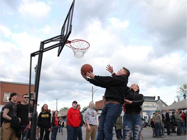 Nova Holt and Riley Burgess of Almonte play a game of King's Court by Almonte Old Town Hall ahead of a community screening of the Warriors-Raptors game.