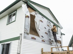 Repair work was continuing Monday on this Orléans home damaged by the Sunday evening tornado.