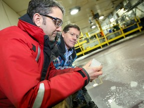 Louis Poirier  of the NRC shows reporter Tom Spears how to crash a bridge into ice.