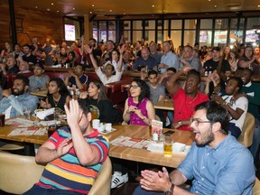 Toronto Raptors fans cheer on their team in Game 6 of the 2019 NBA FInals against the Golden State Warriors at the Sens House in the ByWard Market.