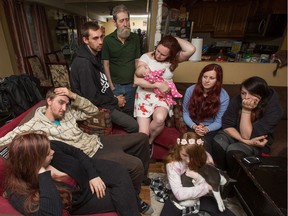 Nick Hickey's family gathers in advance of what's expected to be a not criminally responsible finding in his homicide. From left: Jordan Armstrong, Joshua Hickey, Joey Hickey, Pete Mellon, Tracy Mellon with granddaughter Scarlett, Christiana Ouellette, Pam Thompson and Vicky Mellon, with cat.