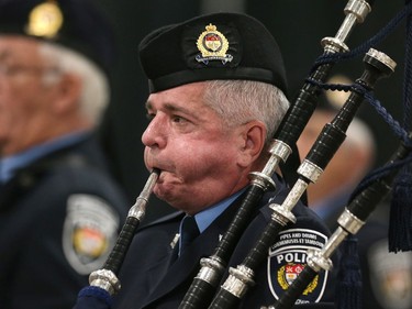 A piper hard at work as 88 Ottawa Police Service recruits received their police badges as part of the graduating ceremony held at the EY Centre.