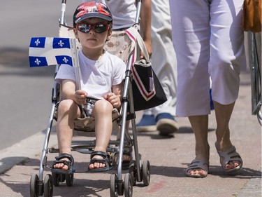 3 year old Xavier Charbonneau was travelling in style as he arrived to take in the Saint-Jean-Baptiste Day parade in Gatineau on June 24, 2019.