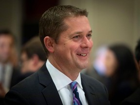 (FILES) In this file photo taken on May 07, 2019 Andrew Scheer, leader of the Conservative Party of Canada, smiles during an event at the Montreal Council on Foreign Relations (MCFR), at the Marriott Chateau Champlain in Montreal.