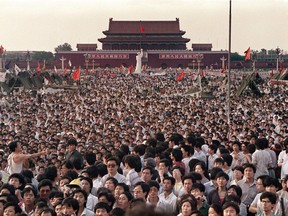 This file photo taken on June 2, 1989 shows people gathered at Tiananmen Square during a pro-democracy protest in Beijing.