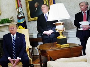 (From left) US President Donald Trump, Secretary of State Mike Pompeo, and National Security Advisor John Bolton are seen during a bilateral meeting with Canada's Prime Minister Justin Trudeau in the Oval Office of the White House in Washington, DC on June 20, 2019.