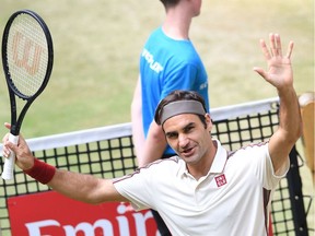 Roger Federer from Switzerland reacts after he won his match against Pierre-Hugues Herbert from France at the ATP tennis tournament in Halle, western Germany, on June 22, 2019.