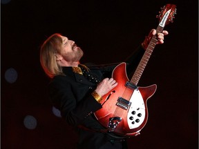 (FILES) In this file photo taken on February 3, 2008 musician Tom Petty performs during halftime at Super Bowl XLII at the University of Phoenix Stadium in Glendale, Arizona. - Estates of rapper Tupac Shakur and rocker Tom Petty are among a group seeking at least $100 million in damages from Universal Music Group after revelations that a 2008 fire allegedly torched precious master recordings. The class action lawsuit filed just before the weekend is the first legal action lobbed at UMG since The New York Times published a bombshell investigation saying that a trove of some 500,000 recordings including masters were destroyed in the June 1, 2008 blaze.