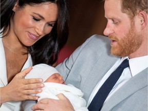 Prince Harry and Meghan, Duchess of Sussex hold their baby son.