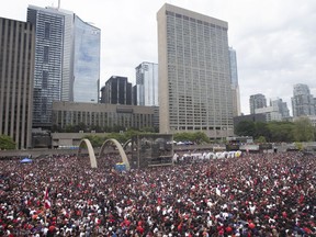 Crowds gather in Nathan Phillips Square as they prepare to celebrate the Toronto Raptors winning the NBA Championship in Toronto on Monday, June 17, 2019.