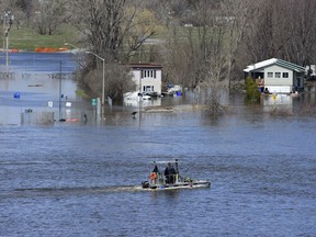 Homes along the Ottawa River in Gatineau, Que. are flooded on Tuesday, April 30, 2019. The National Capital Commission is learning it can no longer treat extreme events like this spring's flooding as "exceptional," a spokesperson for the company said Wednesday.