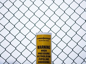 The federal government is widely expected to green light the Trans Mountain expansion project a second time today but, even with a Yes vote, construction is likely weeks, if not months away. A sign warning of an underground petroleum pipeline is seen on a fence at Kinder Morgan's facility where work is being conducted in preparation for the expansion of the Trans Mountain Pipeline, in Burnaby, B.C., on Monday April 9, 2018.