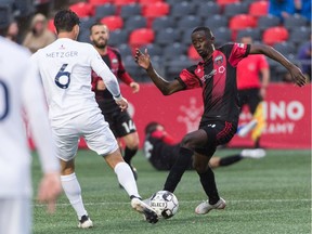 Mour Samb, right, of Ottawa Fury FC tries to poke the ball away from Dan Metzger of Memphis 901 FC during a United Soccer League Championship match at TD Place Stadium in Ottawa, ON. Canada on June 15, 2019. The game ended in a 0-0 draw.