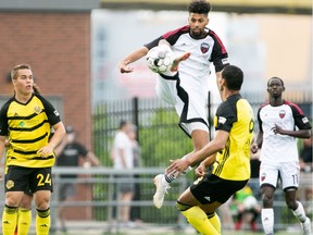 Wal Fall of Ottawa Fury FC leaps to play the ball away from Steevan Dos Santos (8) of Pittsburgh Riverhounds SC during a United Soccer League Championship match in Pittsburgh on Saturday, June 8, 2019. The match ended in a 2-2 draw. Chris Cowger / Pittsburgh Riverhounds SC