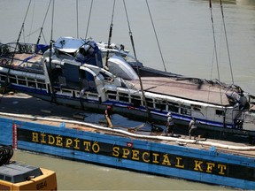 The Mermaid, a Hungarian boat which sank in the Danube river near Margaret bridge, is lifted from the water during a salvage operation in Budapest, Hungary June 11, 2019.