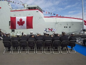 Royal Canadian Sea Cadets wait for the start of the naming ceremony for Canada's lead Arctic and Offshore Patrol Ship, the future HMCS Harry DeWolf, at Halifax Shipyard in Halifax on Friday, Oct. 5, 2018.