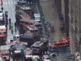 Emergency vehicles are seen outside 787 7th Avenue in midtown Manhattan where a helicopter crashed in New York City, New York, U.S., June 10, 2019.
