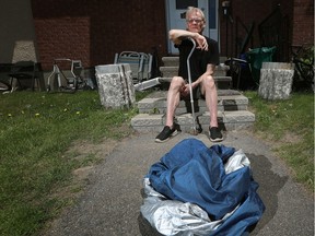 Robert Simser sits outside his home on Friday June 7, 2019.  Someone stole his electric wheelchair from outside his home and he is desperate to get it back.