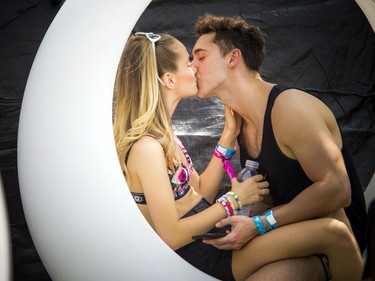 Luca Pallotta and Brigitte Lefebvre enjoy a kiss together at Escapade Music Festival Saturday, June 22, 2019 at Lansdowne Park.  Ashley Fraser/Postmedia