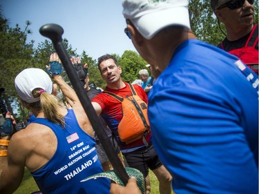 The Ottawa Dragon Boat Festival was held over the weekend on the Rideau River at Mooney's Bay. Teams high five each other after racing Saturday.   Ashley Fraser/Postmedia