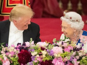 Britain's Queen Elizabeth II laughs with US President Donald Trump during a State Banquet in the ballroom at Buckingham Palace in central London on June 3, 2019, on the first day of the US president and First Lady's three-day State Visit to the UK.