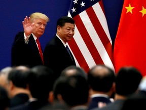 U.S. President Donald Trump and China's President Xi Jinping meet business leaders at the Great Hall of the People in Beijing, China, November 9, 2017.